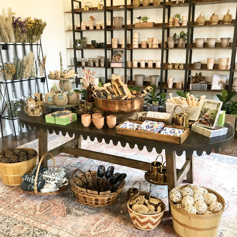 The Mercy Goods retail shop styled with garden goods, baskets, and handmade wares