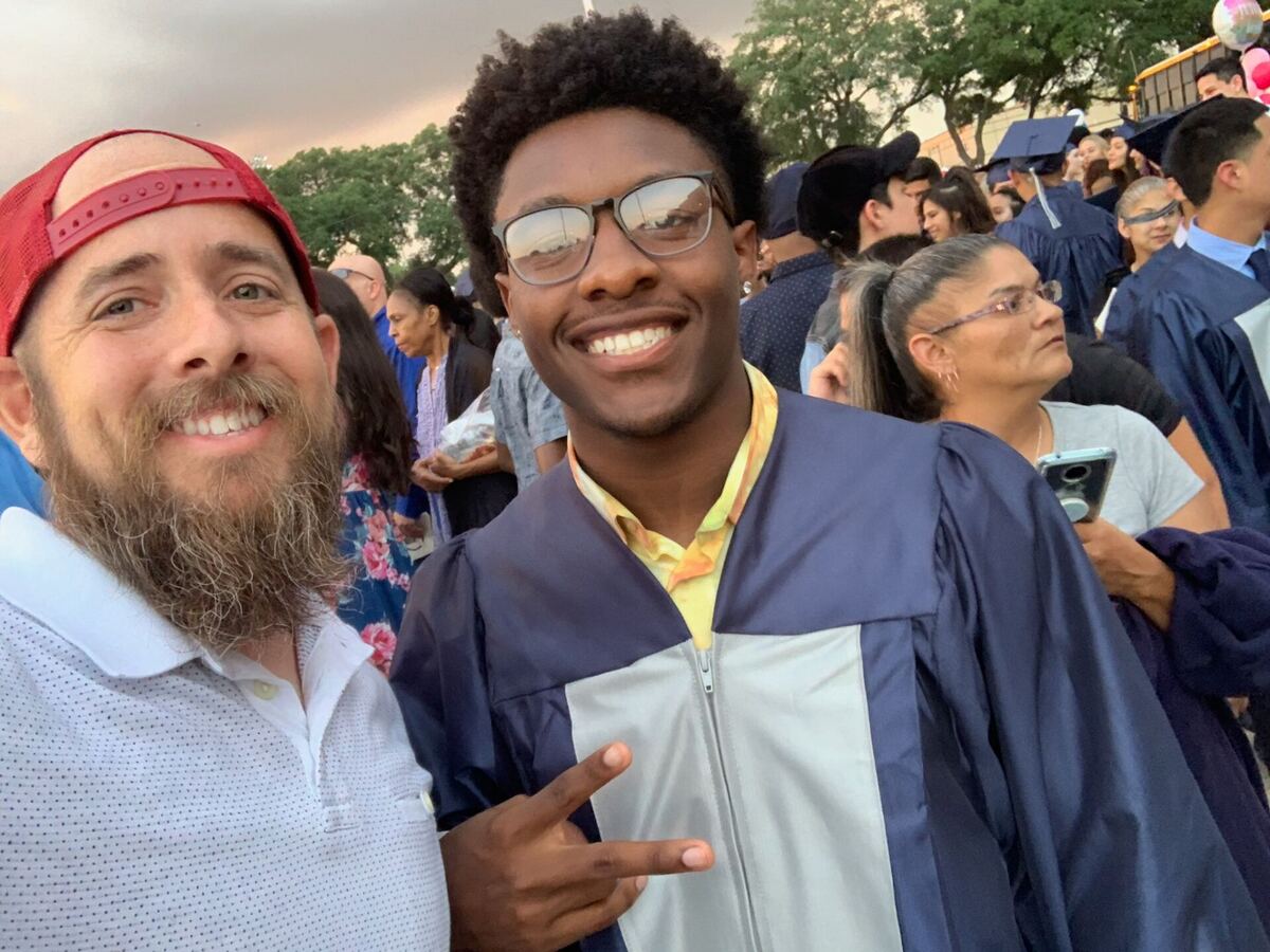 A Mercy Goods graduate and his mentor celebrating together at graduation